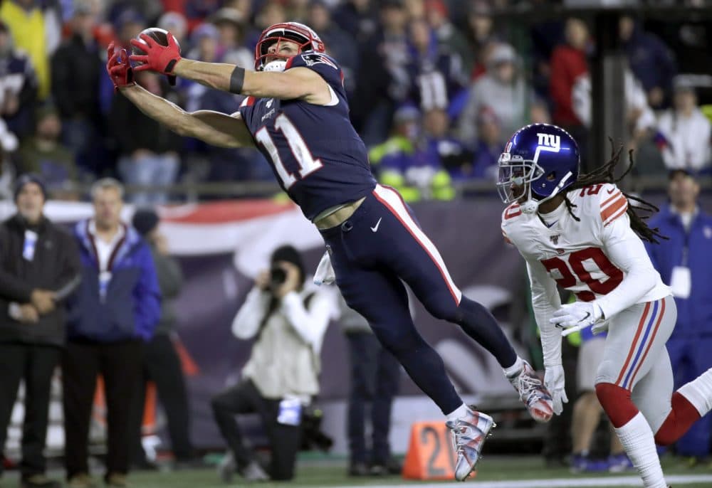 New England Patriots wide receiver Julian Edelman stretches out to catch a pass in front of New York Giants cornerback Janoris Jenkins, right, in the second half ofthe game Thursday (Elise Amendola/AP)