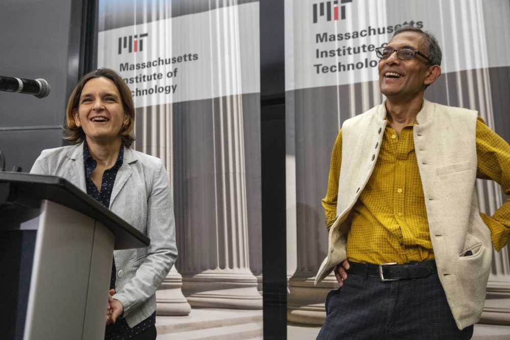 Esther Duflo, left, and Abhijit Banerjee speak during a news conference at MIT on Monday. Banerjee and Duflo, along with Harvard's Michael Kremer, were awarded the 2019 Nobel Prize in economics for pioneering new ways to alleviate global poverty. (Michael Dwyer/AP)