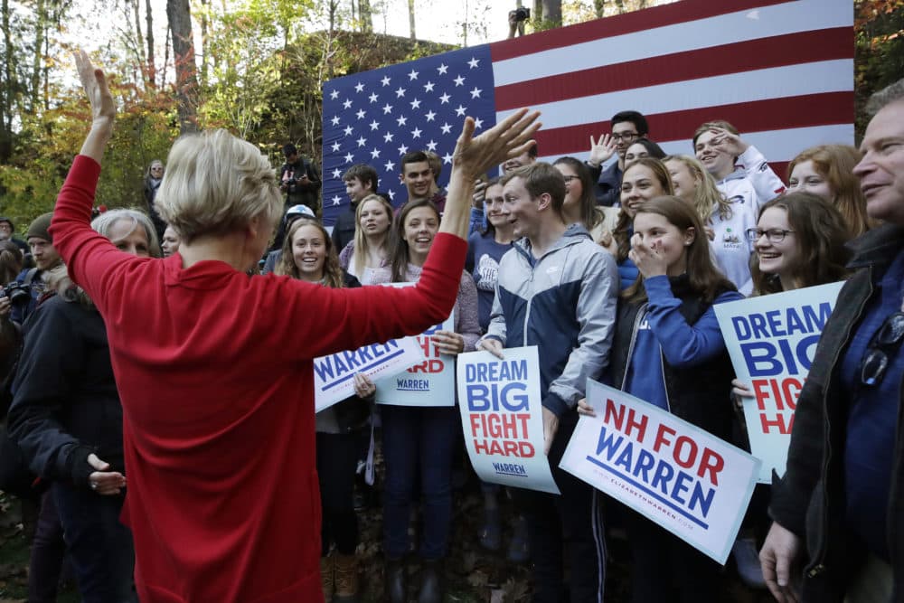 Warren greets area high school students at a campaign event on the campus of Dartmouth College in Hanover, N.H. (Elise Amendola/AP)