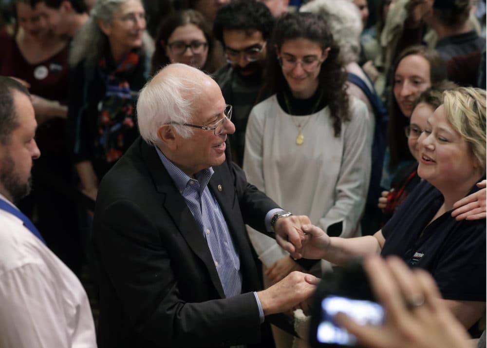 Sanders greets people in the crowd at the conclusion of the event. (Steven Senne/AP)