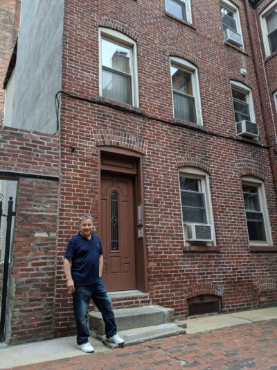 Anthony Martignetti stands on Powers Court in the North End. (Jamie Bologna/WBUR)