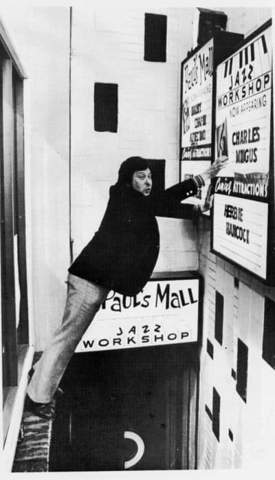 Fred Taylor updating a marquee at Paul's Mall. (Courtesy)