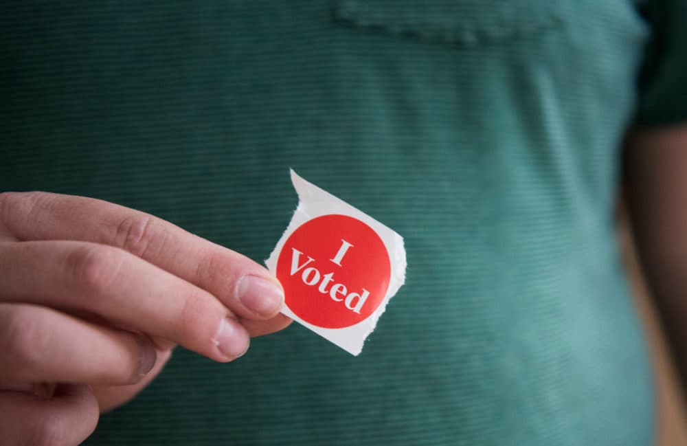 A voter in Minnesota holds their &quot;I Voted&quot; sticker. (Stephen Maturen/Getty Images)