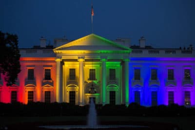 The White House stands illuminated in rainbow colored light at dusk in Washington, D.C. (Drew Angerer/Bloomberg via Getty Images)