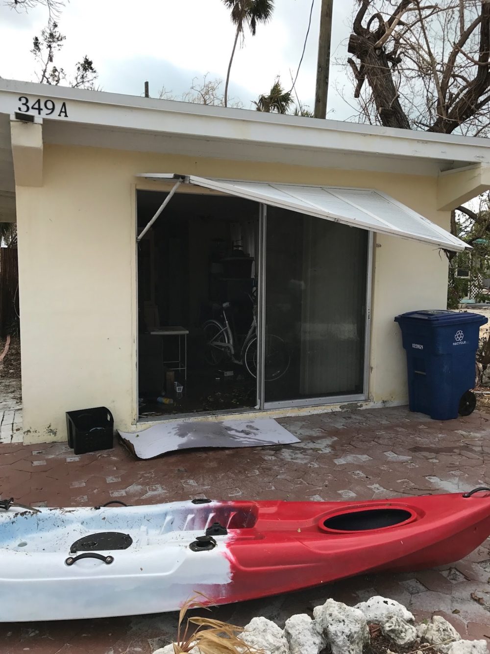 The outside of her house post-Irma. She says the kayak is not hers. It's one of the many items that washed up onto her property. (Courtesy of Rittel) 