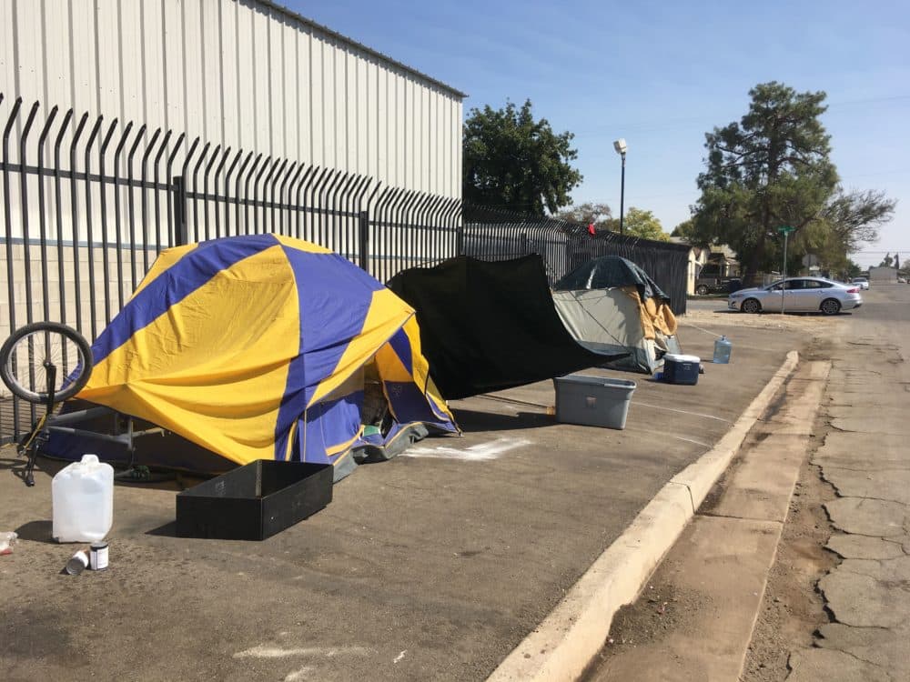 A street lined with tents of homeless people in Bakersfield, California. (Alex Ashlock/Here &amp; Now) 