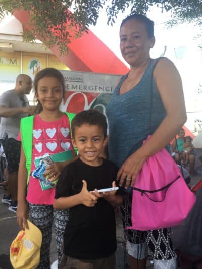 Francisca Castro and her children, Angely and Emanuel. The family, originally from Honduras, now lives in the Matamoros border encampment. (Yasmin Amer/WBUR)