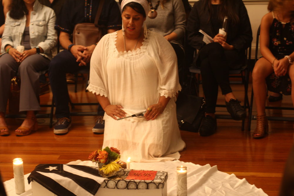Luana Morales, a birth, death, and ancestral healing arts practitioner, honors those who died during and in the aftermath of Hurricane Maria. (Courtesy Emilio Guillermo)