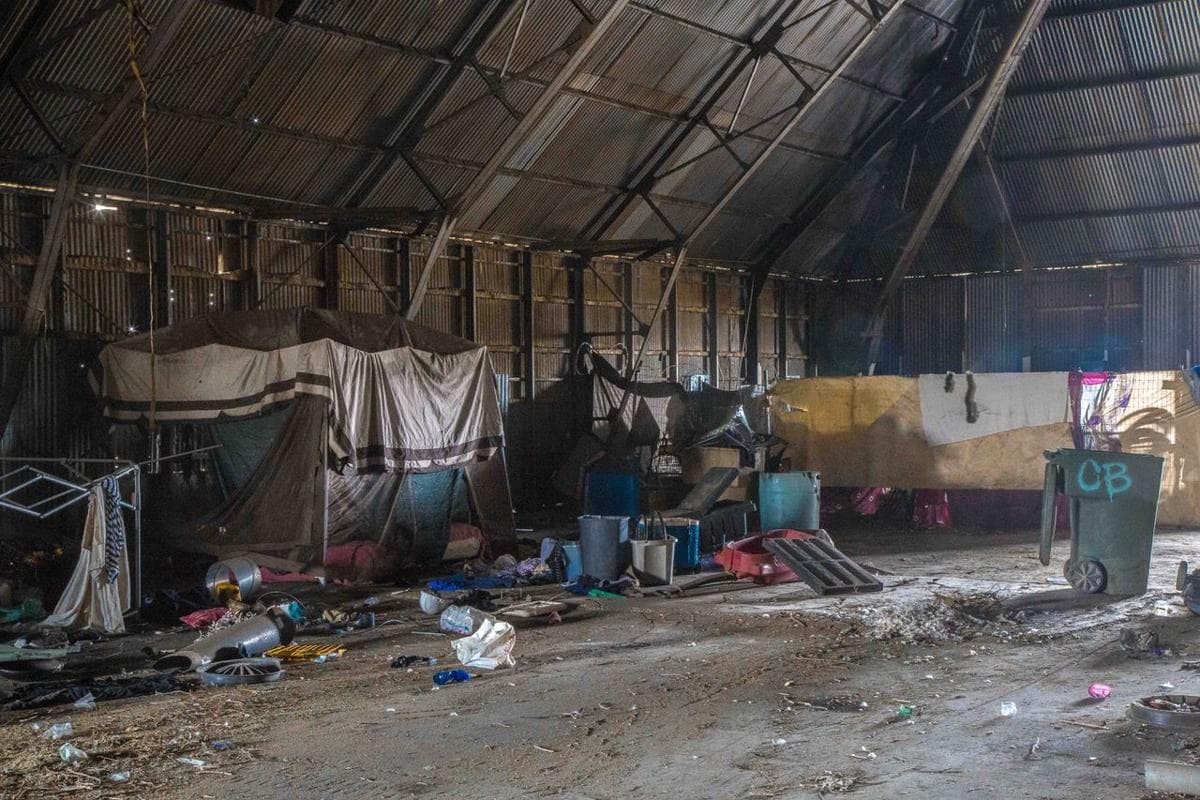 An abandoned factory warehouse serves as shelter for some homeless people in Bakersfield, California. (Photo by Michael K. Chadburn)