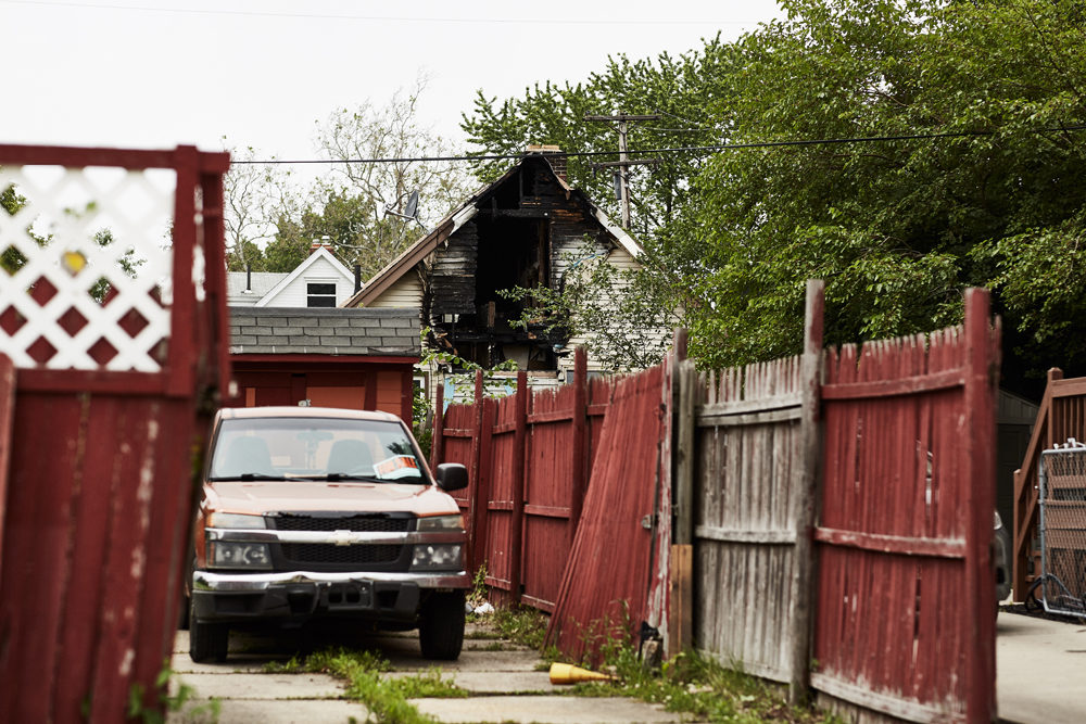 Properties with severe damage are often fast tracked to the demolition process due to risks to the community. This house in the Collinwood neighborhood appears to be in good shape from the facade, but the view from the back shows a fire has gutted the structure. (Paul Sobota/Here &amp; Now) 