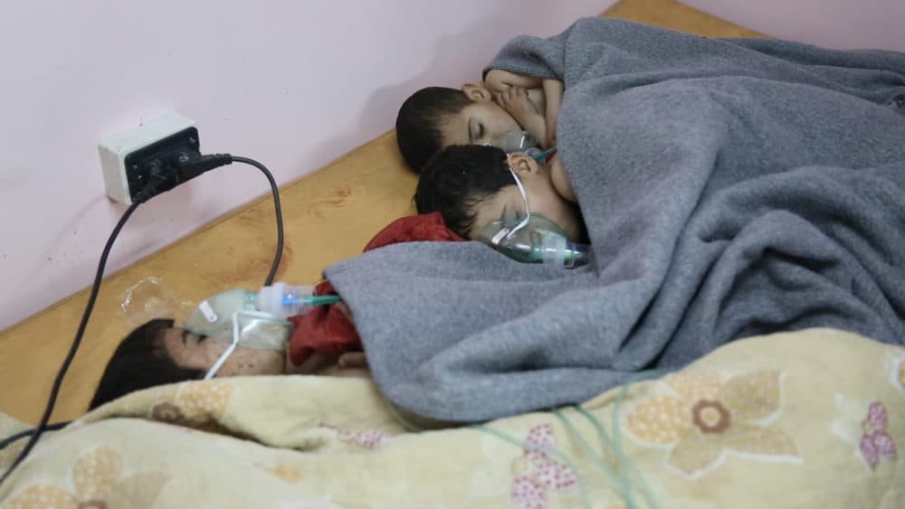 Children recovering with oxygen after a chemical attack. (National Geographic)
