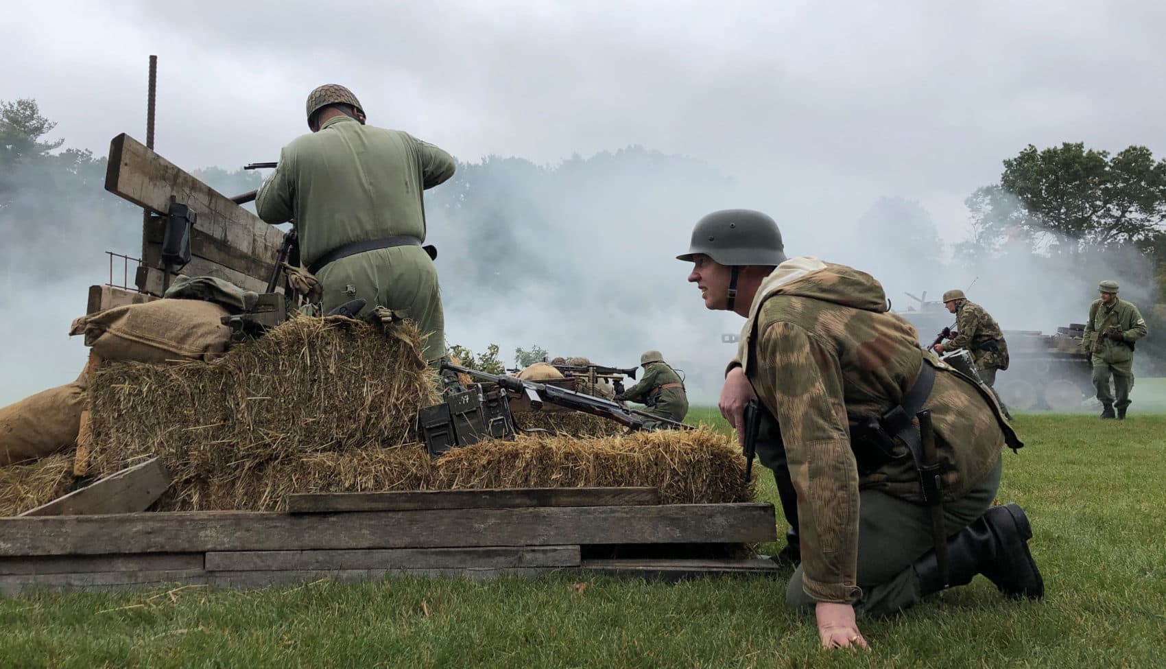Actors fired vintage weapons during a World War II reenactment at the Collings Foundation's American Heritage Museum in Hudson on Oct. 12. (Callum Borchers/WBUR)