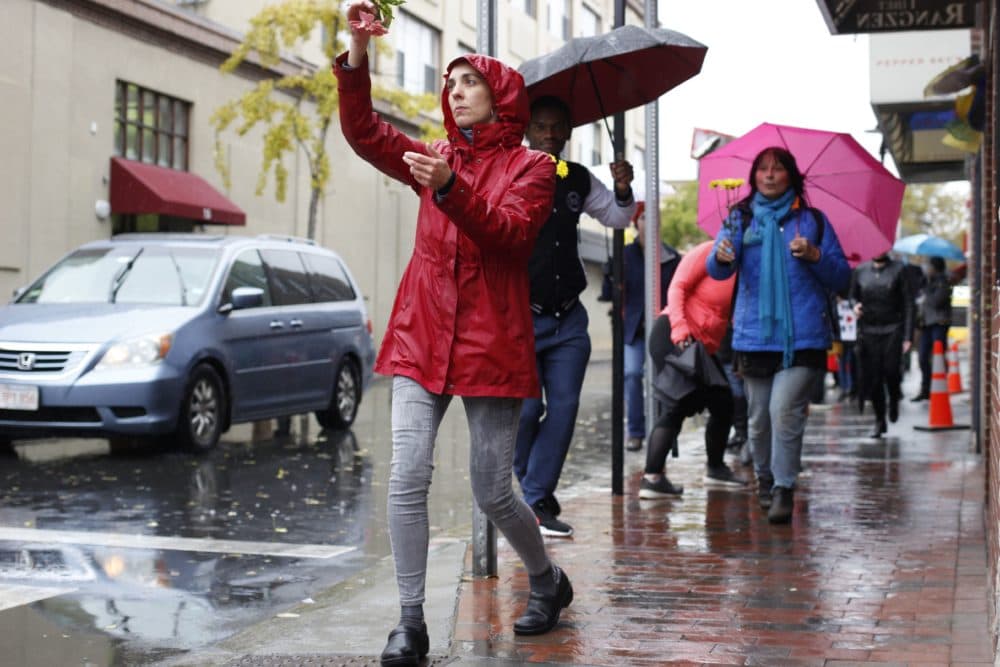 Despite the rain and the unfortunate circumstances that brought them together, the protesters on Sunday sashayed and twirled down the block back to Green Street Studios for one last plie. (Jenn Stanley for WBUR)