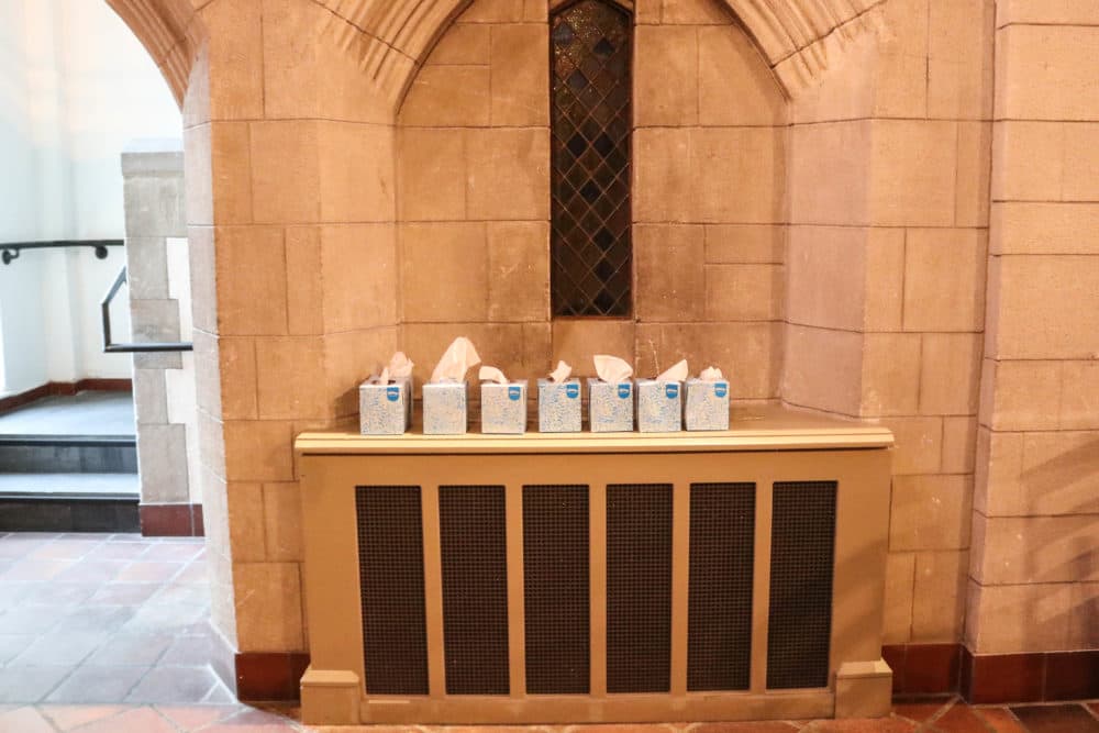 Tissues line a wall at a death cafe inside Bigelow Chapel at Mount Auburn Cemetery (Olivia Deng for WBUR)