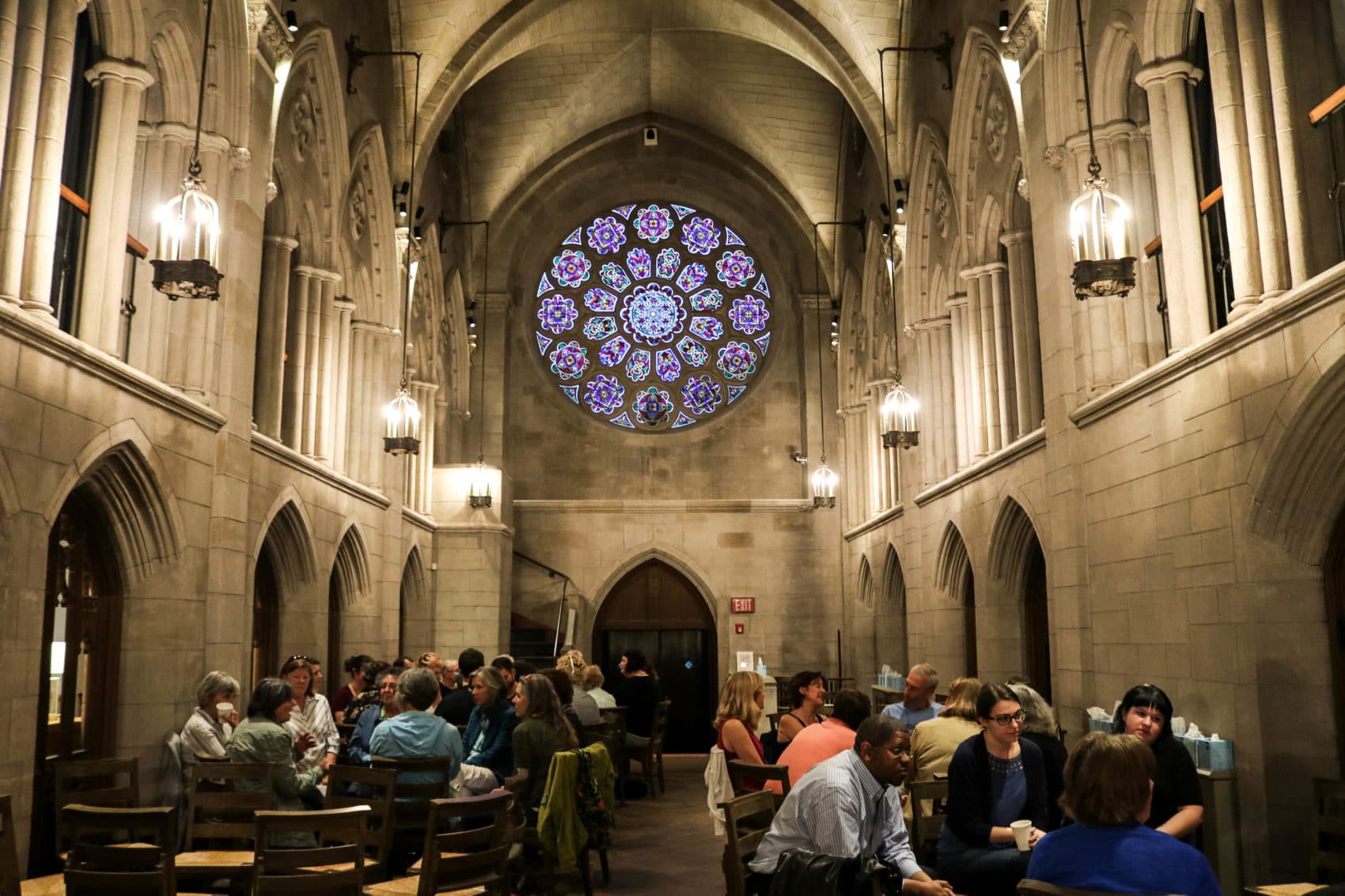 At a death cafe inside Bigelow Chapel at Mount Auburn Cemetery, people gather to enjoy cake and tea while discussing death and mortality in a safe space. (Olivia Deng for WBUR)