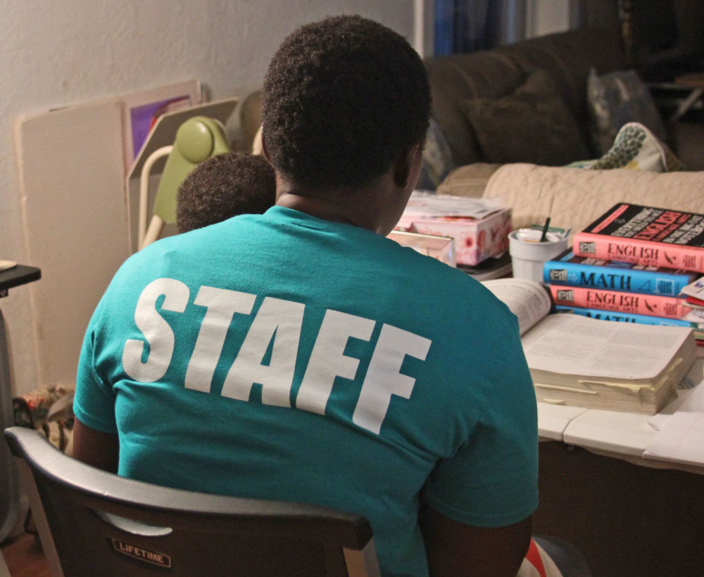 The 35-year-old Zimbabwean woman, who goes by Shalom, now lives and works at La Posada and is studying for her GED. (Yasmin Amer/WBUR)