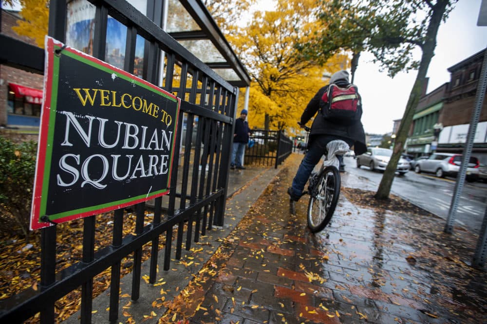 A “Welcome to Nubian Square” sign at the gate of the Dudley Square Plaza on Washington Street. (Jesse Costa/WBUR)
