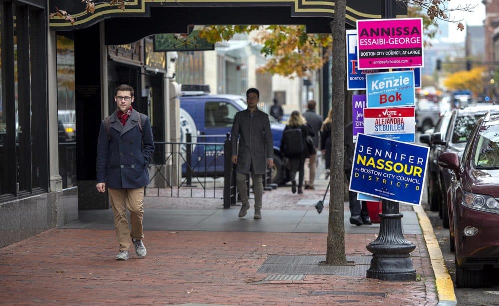 Campaign signs are seen on Boylston Street, near the Boston Public Library polling place. (Robin Lubbock/WBUR)