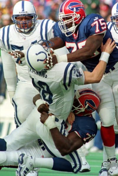 Bruce Smith (78) and Marcellus Wiley (75) team up to tackle Peyton Manning. (Don Heupel/AP)