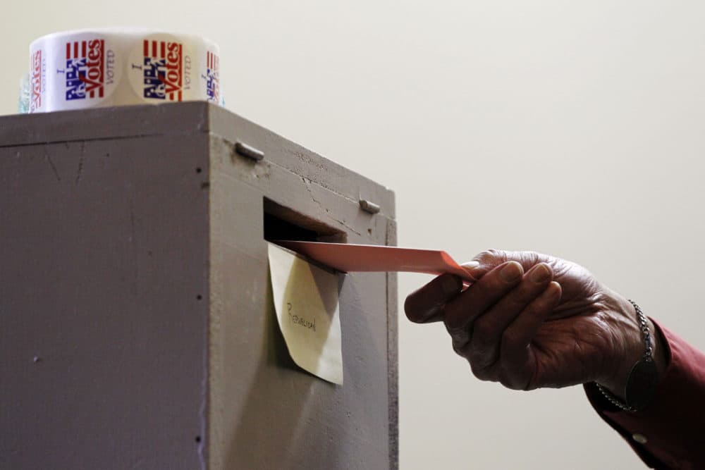 A vote is cast during the 2012 new Hampshire primary. (Matt Rourke/AP)