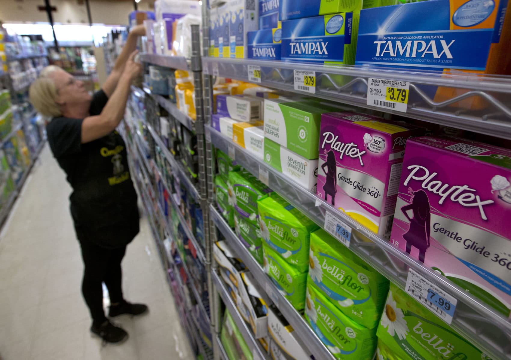 Tammy Compton restocks a shelf at Compton's Market, Wednesday, June 22, 2016, in Sacramento, Calif. (Rich Pedroncelli/AP)