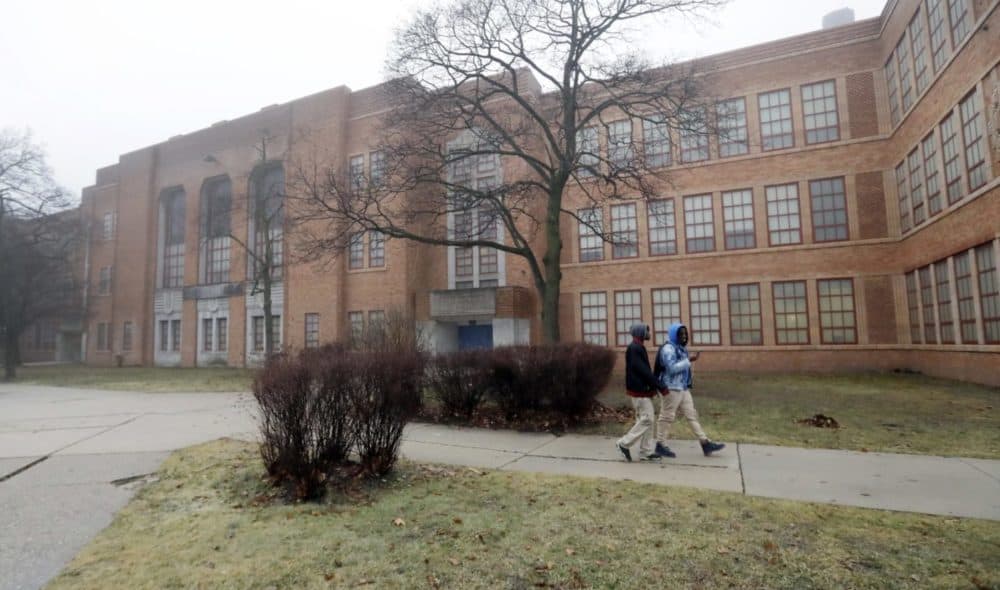 Students walk outside Pershing High School, Friday, Jan. 20, 2017, in Detroit. (Carlos Osorio/AP)