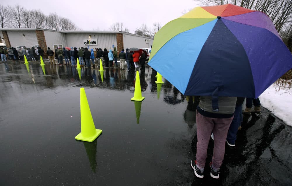 Customers line up outside the Cultivate dispensary to purchase recreational marijuana on the first day of legal sales in Leicester, Mass. (Steven Senne/AP)