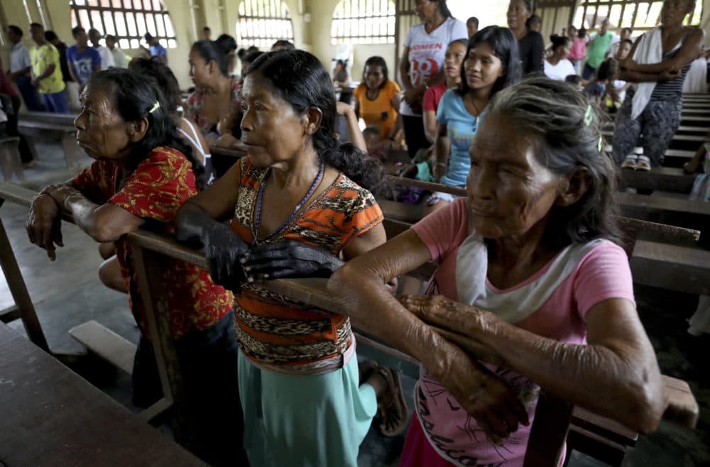 Indigenous Tikuna women attend Catholic Mass in Nazareth, Colombia, Sunday, Sept. 8, 2019. Catholic villagers say that the community only gets visited by priests on special occasions and that having someone who could perform sacraments on a regular basis would revitalize the Catholic faith. (Fernando Vergara/AP)