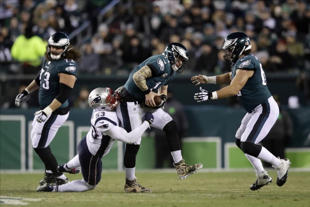 New England Patriots' Kyle Van Noy (53) tackles Philadelphia Eagles' Carson Wentz (11) during the first half of the game. (Matt Rourke/AP)