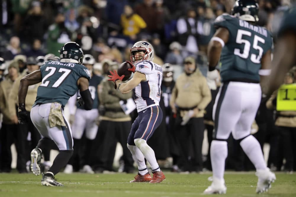 New England Patriots' Julian Edelman (11) throws a touchdown pass during the second half of the game against the Philadelphia Eagles Sunday. (Matt Rourke/AP)