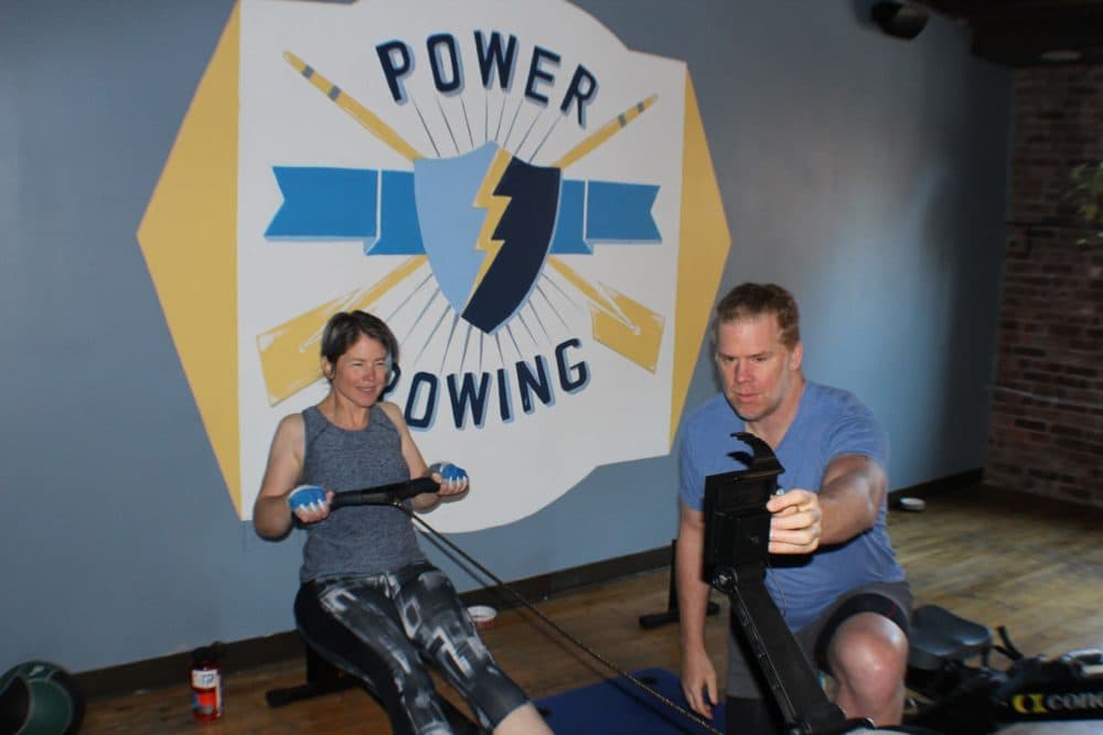 Bethany Ericson and trainer Bryan Fuller at the Power Rowing studio. (Courtesy Bryan Fuller)