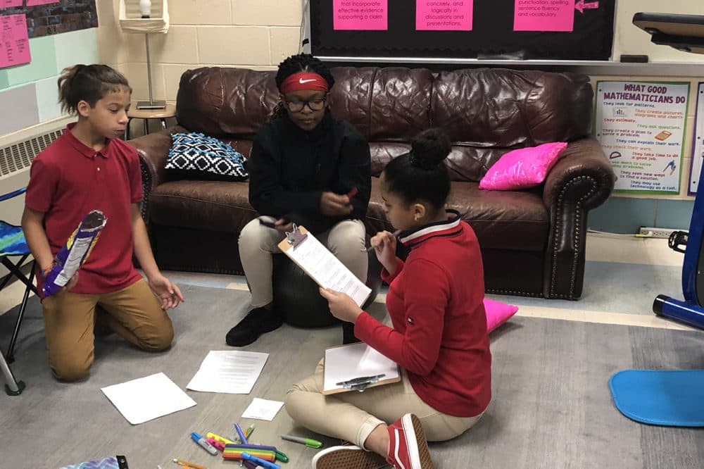 Seventh graders at Springfield Renaissance School working on values to guide discussions in &quot;crew,&quot; a part of the day when students owrk on team-building and reflect on their learning. (Grace Tatter/On Point)