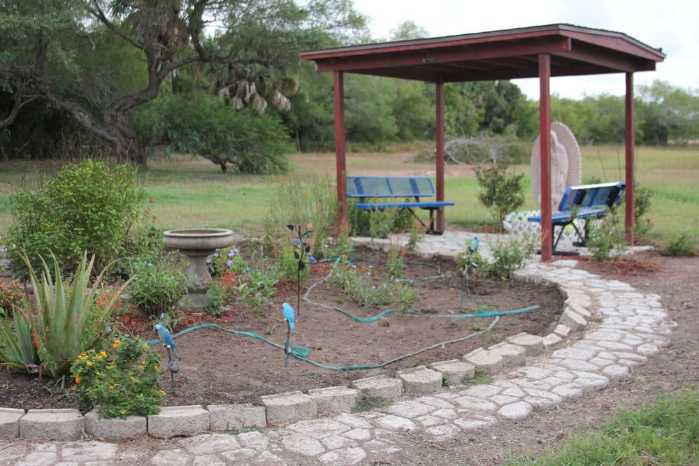 The 'Butterfly Garden' at La Posada Providencia Respite Center is a small, quiet outdoor space where people can relax or pray. (Yasmin Amer/WBUR)