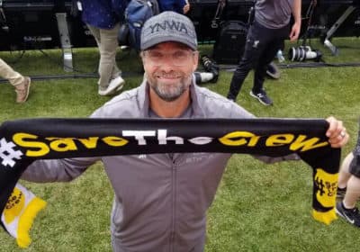 Liverpool F.C. manager Jürgen Klopp posing with a Save The Crew scarf at a match in Ann Arbor on July 28th of 2018. (Courtesy Save the Crew) 