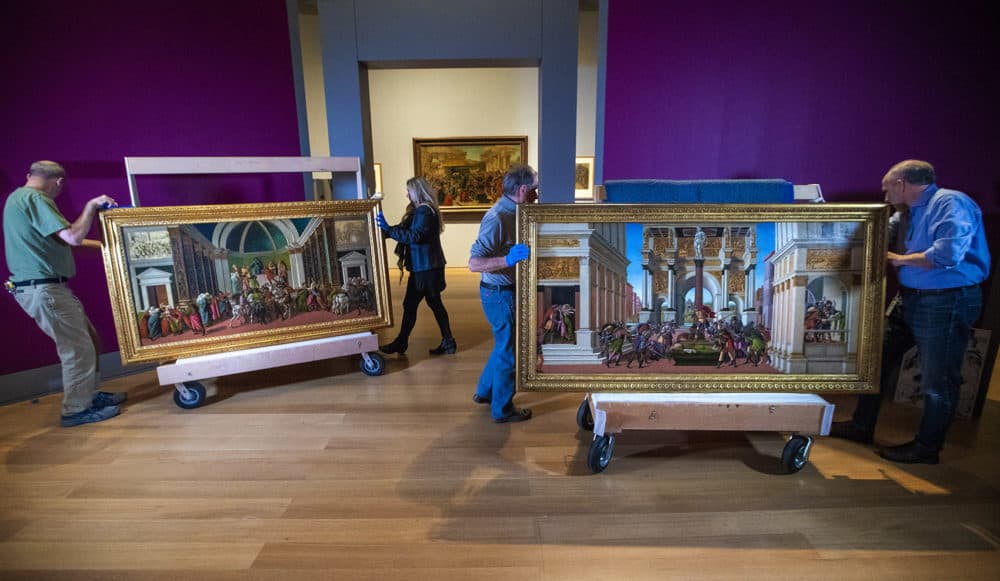 Curators at the Isabella Stewart Gardner Museum inspect and arrange the &quot;The Tragedy of Lucretia&quot; and &quot;The Story of Virginia&quot; by Sandro Botticelli (Jesse Costa/WBUR)