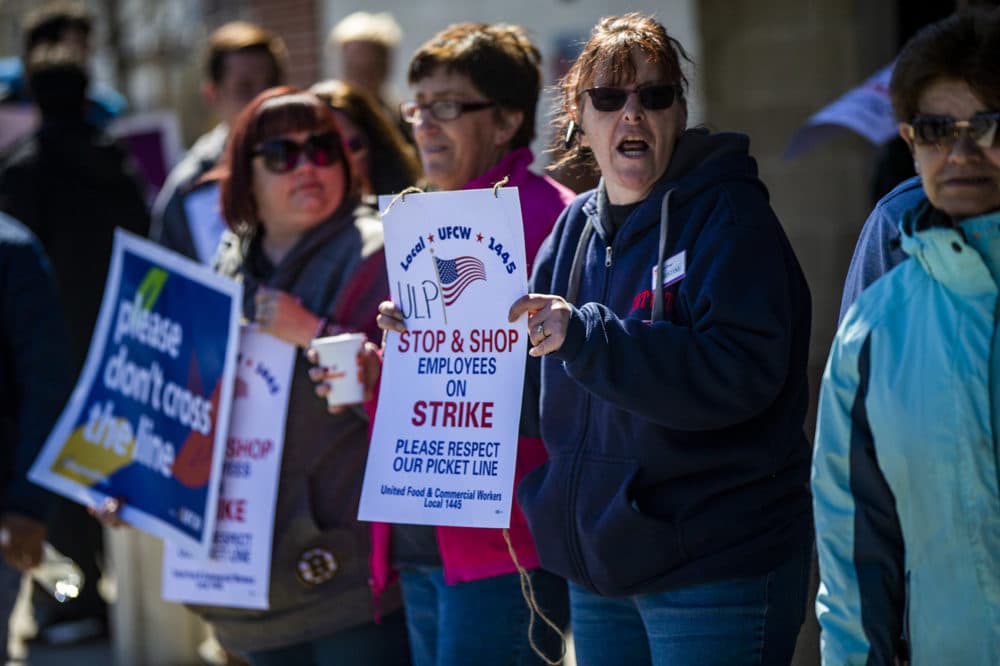 Christine Ricardi, a customer service supervisor, joins in with other workers to stike at the Stop &amp; Shop on McGrath Highway in Somerville. (Jesse Costa/WBUR)
