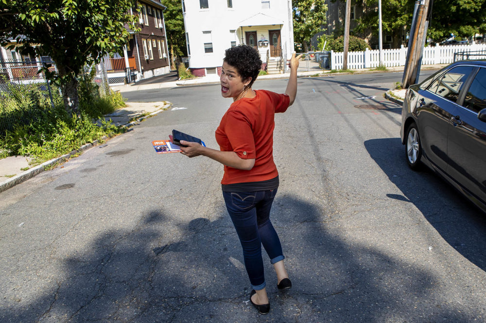 At-large Boston City Councilor candidate Julia Mejia canvases down Evans Street in Dorchester, speaking with prospective voters before the upcoming election. (Jesse Costa/WBUR)