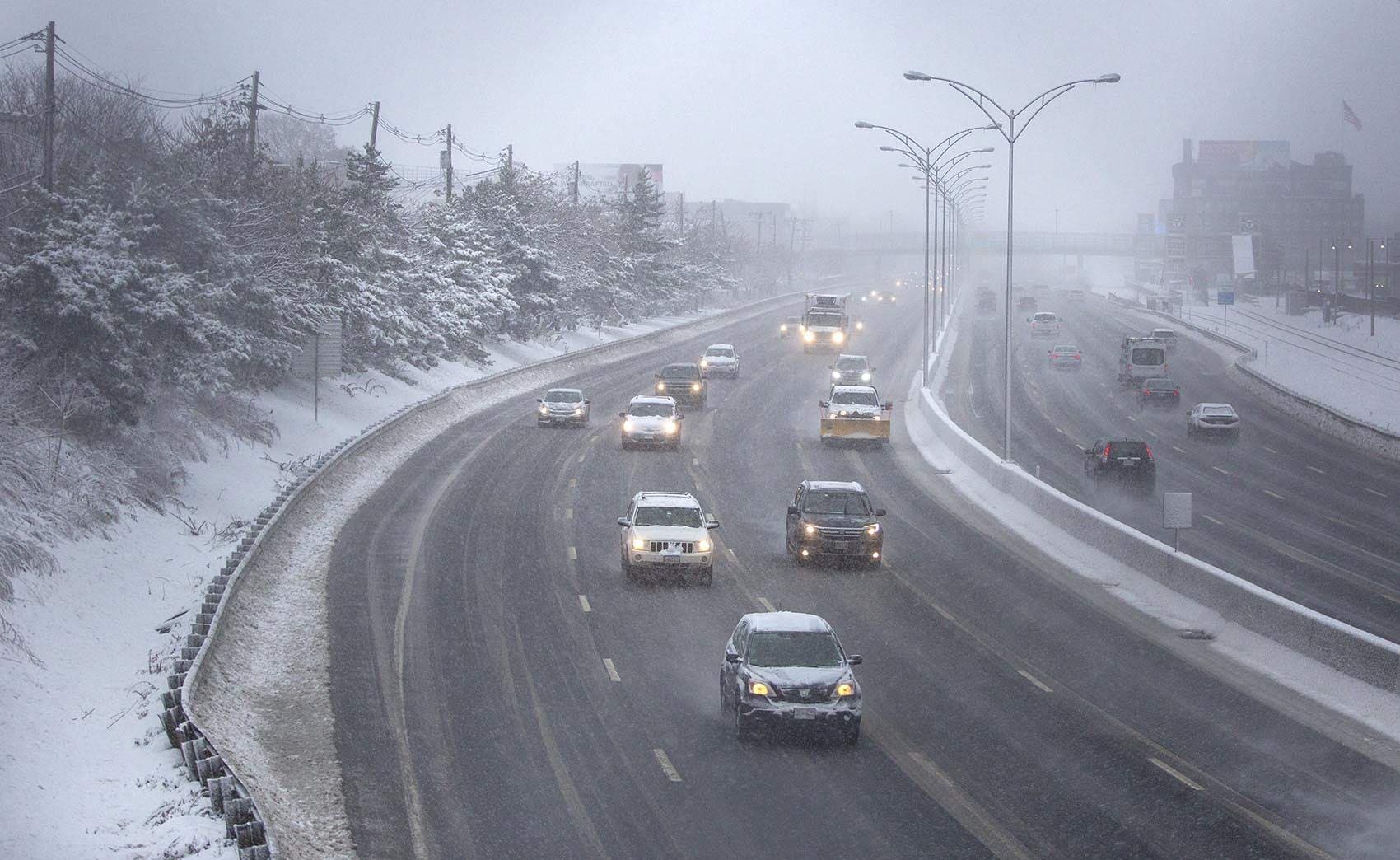 Traffic on the Mass. Pike at rush hour, as snow creates a second slippery commute for Boston drivers. (Robin Lubbock/WBUR)