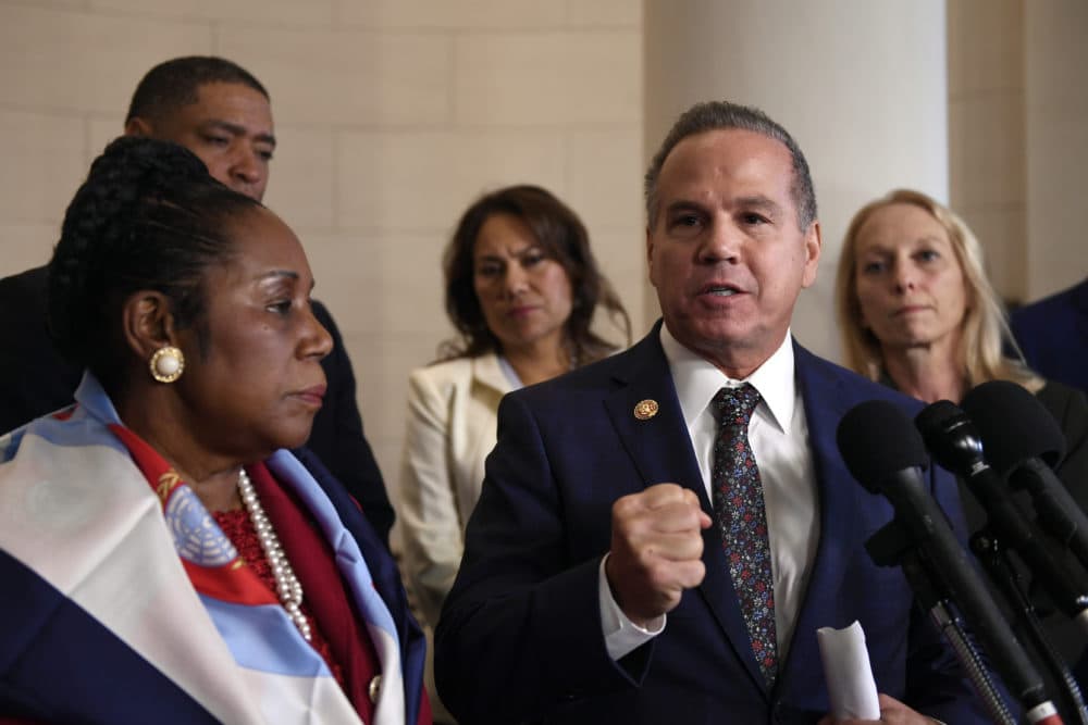 Rep. David Cicilline, D-R.I., second from right, speaks to reporters during a break in the House Judiciary Committee hearing on Capitol Hill in Washington on Dec. 4. (Susan Walsh/AP)