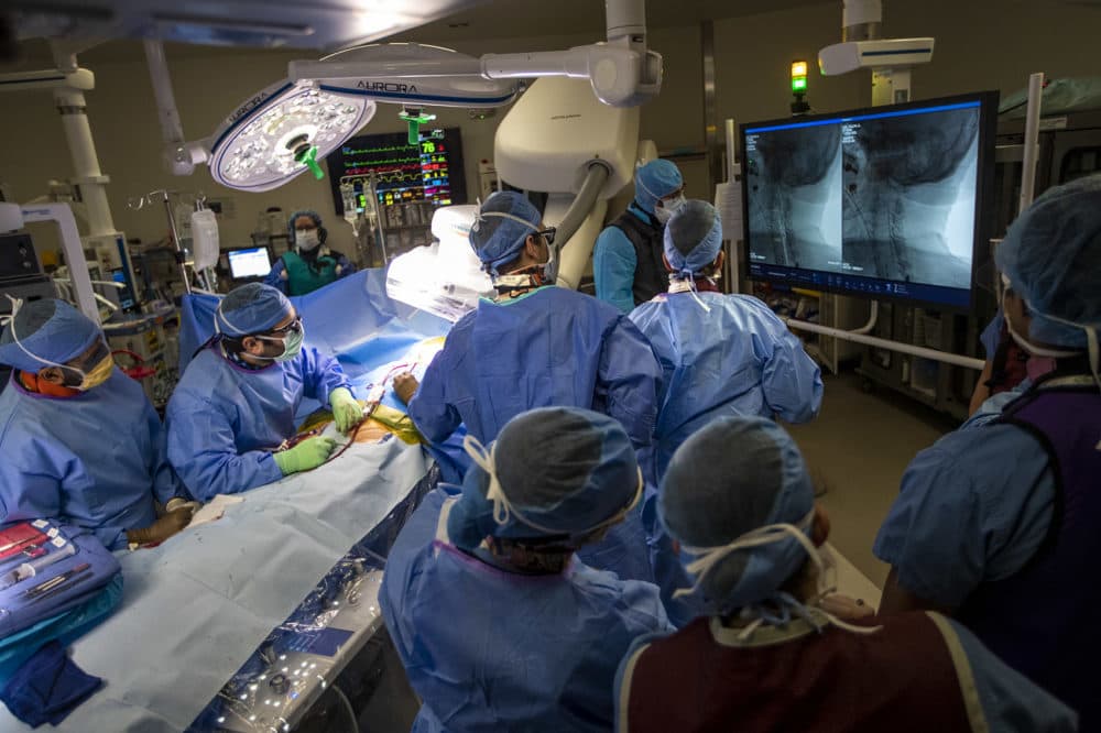 Vascular surgeon Doug Jones and his team perform a carotid endarterectomy at Boston Medical Center. (Jesse Costa/WBUR)