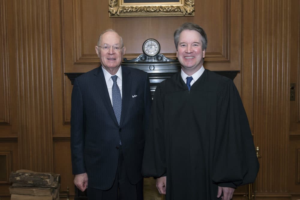 Retired Justice Anthony Kennedy (left) poses with his former law clerk Associate Justice Brett Kavanaugh. (Fred Schilling/Collection of the Supreme Court of the United States via AP)