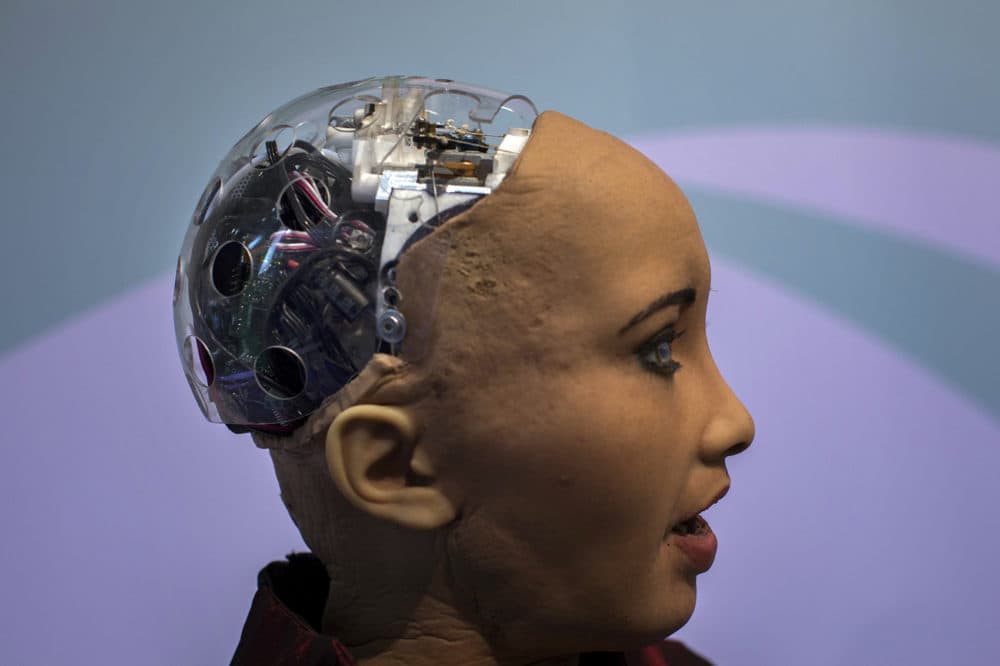 Hanson Robotics' flagship robot Sophia, a lifelike robot powered by artificial intelligence, speaks with visitors, at the Mobile World Congress wireless show, in Barcelona, Spain, Tuesday, Feb. 26, 2019. (Emilio Morenatti/AP)