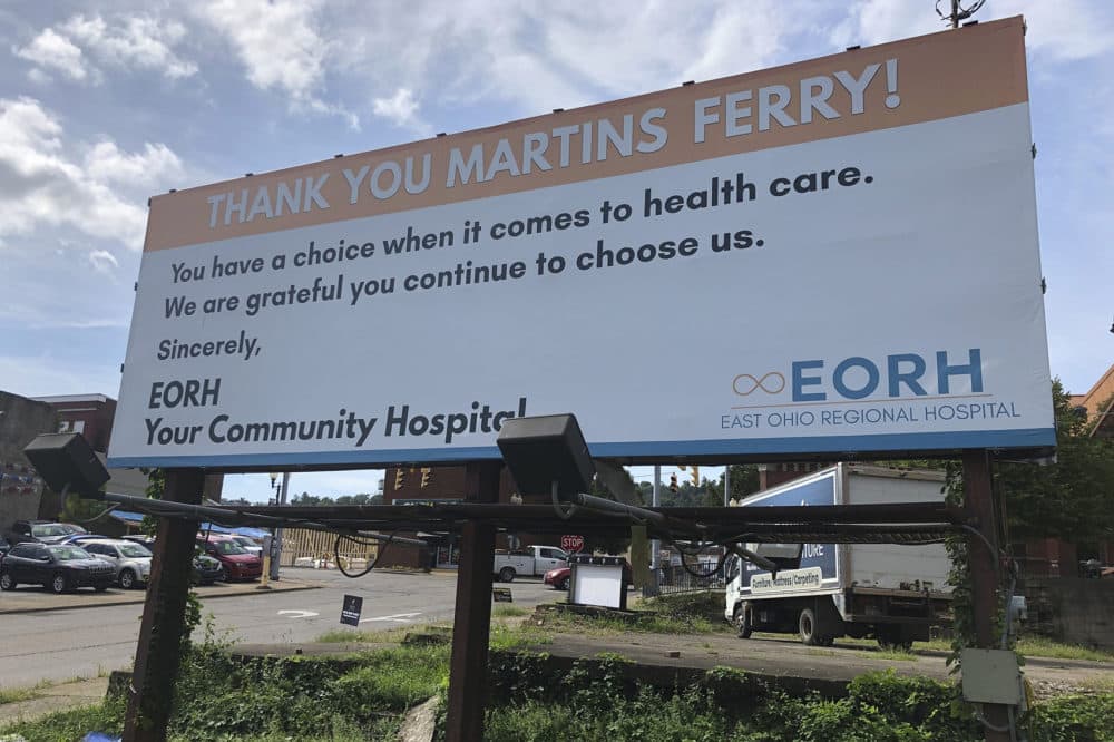 A billboard from East Ohio Regional Hospital is shown Tuesday, Sept. 3, 2019, in Martins Ferry, Ohio. The hospital and sister facility Ohio Valley Medical Center in Wheeling, W.Va., are closing after two years of ownership by Irvine, California-based Alecto Healthcare Services. (John Raby/AP)