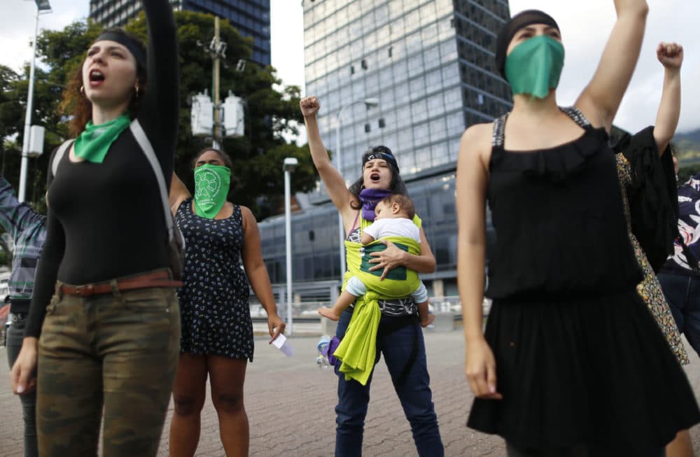 Feminist activists perform “A rapist in your path” at Venezuela square in Caracas, Venezuela. (Ariana Cubillos/AP)