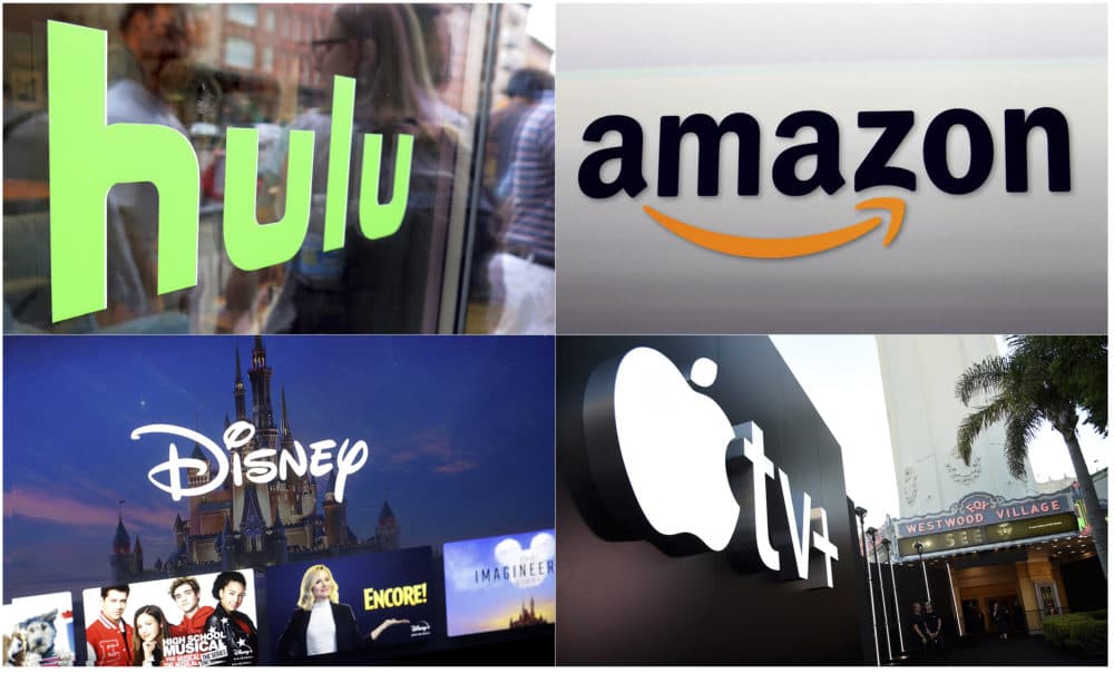 This combination photo shows, clockwise from top left, the Hulu logo on a window at the Milk Studios space in New York, the Amazon logo in Santa Monica, Calif., the Apple TV+ logo displayed outside the Regency Village Theatre in Los Angeles before the premiere of the the Apple TV+ series &quot;See,&quot; and a screen grab of the Disney Plus streaming service on a computer screen. (AP Photo)