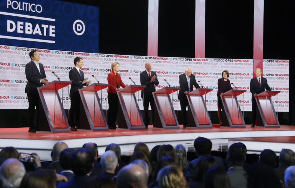 Democratic presidential candidates from left, entrepreneur Andrew Yang, South Bend Mayor Pete Buttigieg, Sen. Elizabeth Warren, D-Mass., former Vice President Joe Biden, Sen. Bernie Sanders, I-Vt., Sen. Amy Klobuchar, D-Minn., and businessman Tom Steyer participate in a Democratic presidential primary debate Thursday, Dec. 19, 2019, in Los Angeles. (Chris Carlson/AP)