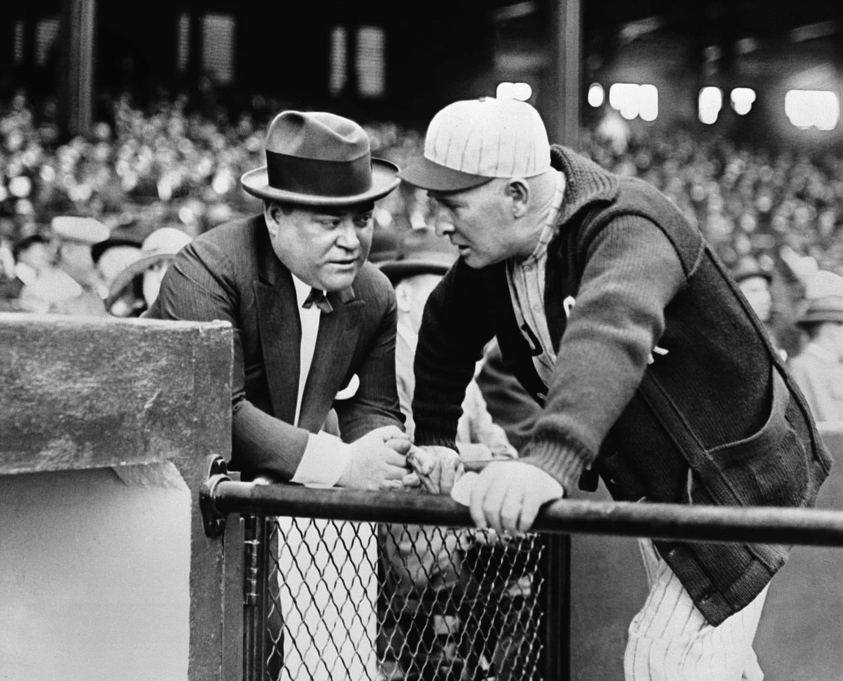 Harry Frazee, left, and Frank Chance, owner and manager of the Boston Red Sox respectively, huddle at New York's Yankee Stadium in 1923. Frazee made the deal that sent Babe Ruth from the Red Sox to the Yankees after the 1919 season. (AP Photo)
