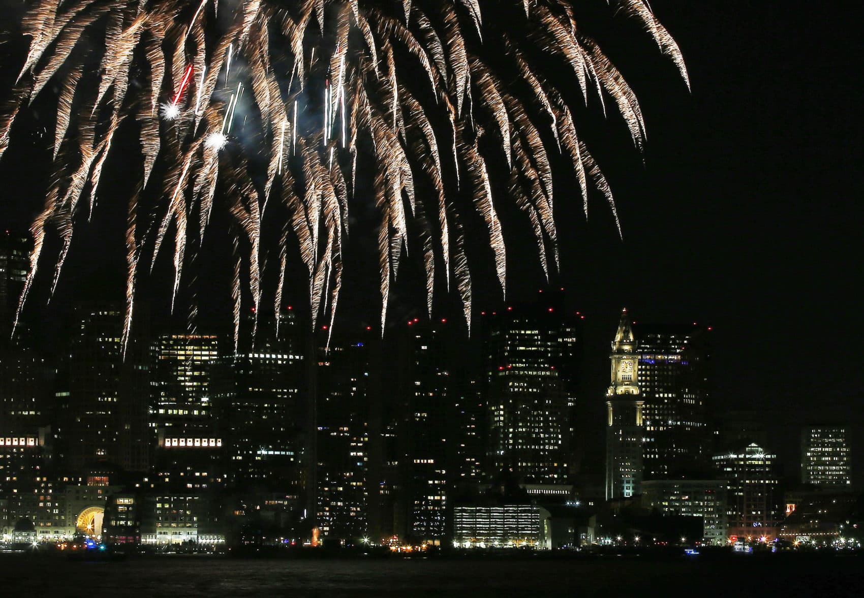 Fireworks light up Boston Harbor in 2014. (Elise Amendola/AP)