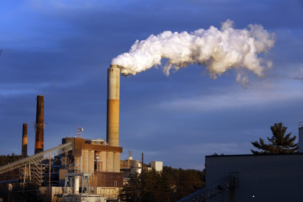 Steam billows from the coal-fired Merrimack Station in Bow, N.H. (Jim Cole/AP)