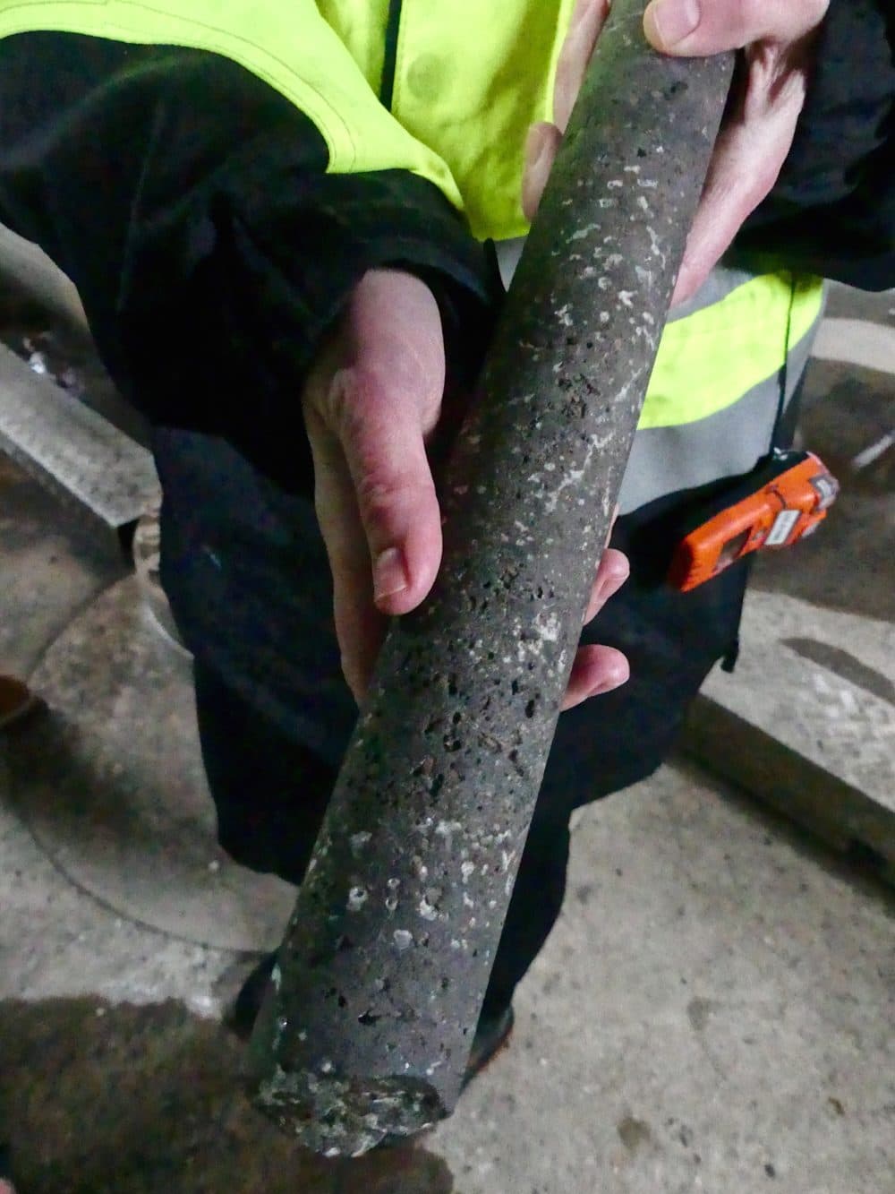 Snæbjörnsdóttir holds a piece of basaltic rock containing crystals of injected carbon. (Karyn Miller-Medzon/Here &amp; Now)